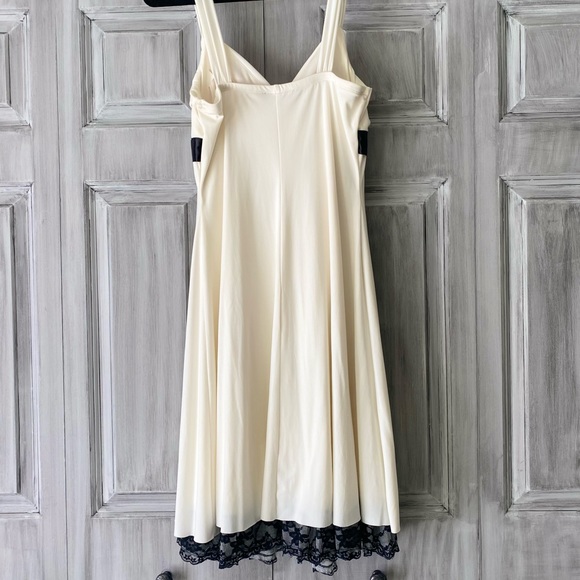 Ivory and black Cocktail dress with lace trim along bottom. - Picture 2 of 5
